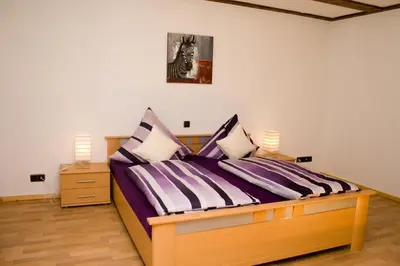 Ein Bett oder Betten in einem Zimmer der Unterkunft Ferienhaus Alina