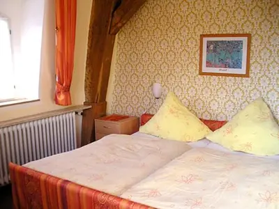 Ein Bett oder Betten in einem Zimmer der Unterkunft Gasthof Graf-Zils