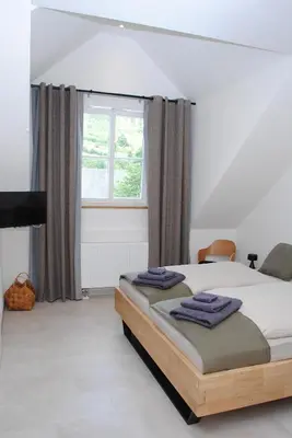 Ein Bett oder Betten in einem Zimmer der Unterkunft Landhaus Gräfendhron