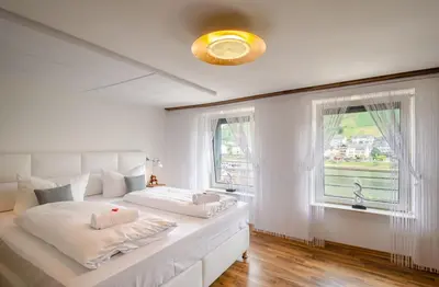 Ein Bett oder Betten in einem Zimmer der Unterkunft MoselUnion - 