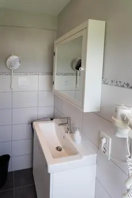 Ein Badezimmer in der Unterkunft Hotel Restaurant Sonnenlay