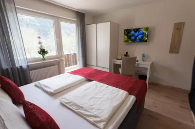 Ein Bett oder Betten in einem Zimmer der Unterkunft Hotel Restaurant Sonnenlay