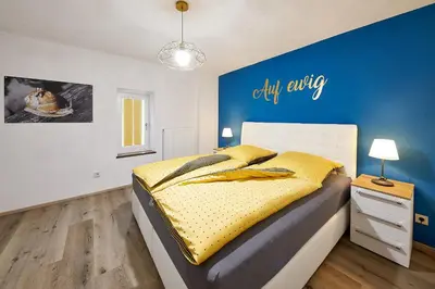 Ein Bett oder Betten in einem Zimmer der Unterkunft Ferienhaus Mosel-Herberge