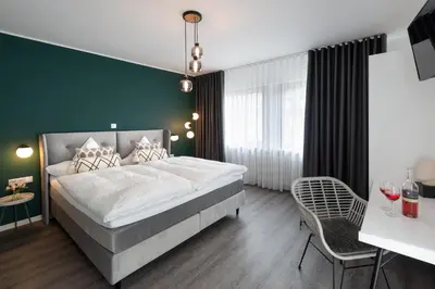 Ein Bett oder Betten in einem Zimmer der Unterkunft Moselweingut & Gästehaus Hubertushof