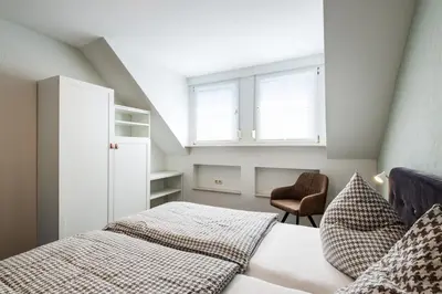 Ein Bett oder Betten in einem Zimmer der Unterkunft Moselweingut & Gästehaus Hubertushof