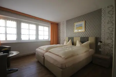 Ein Bett oder Betten in einem Zimmer der Unterkunft Alter Posthof Ferienwohnungen