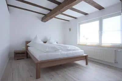 Ein Bett oder Betten in einem Zimmer der Unterkunft Laubach Ferienwohnung - Fam.Lorenz