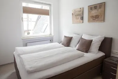 Ein Bett oder Betten in einem Zimmer der Unterkunft Hotel am Markt