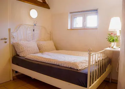 Ein Bett oder Betten in einem Zimmer der Unterkunft Traumwohnung Jolly Jumper auf idyllischem Reiterhof nähe Burg Eltz