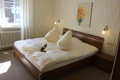 Ein Bett oder Betten in einem Zimmer der Unterkunft Weinstube byCASTORs