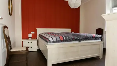Ein Bett oder Betten in einem Zimmer der Unterkunft Ferienhaus Alte Schule