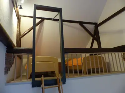 Ein Bett oder Betten in einem Zimmer der Unterkunft Ehemaliges Schusterhaus mit Dachterrasse - Ferienhaus
