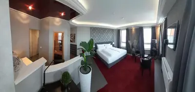 Ein Bett oder Betten in einem Zimmer der Unterkunft Hotel Garni am Schloss