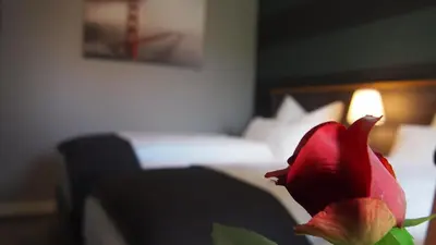 Ein Bett oder Betten in einem Zimmer der Unterkunft Hotel Garni am Schloss