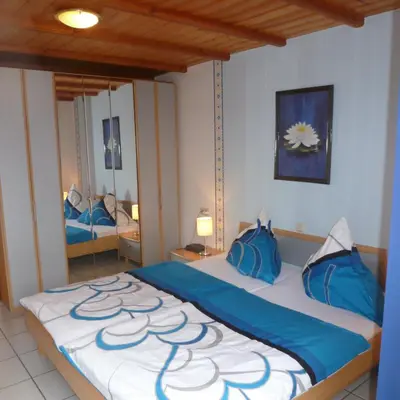 Ein Bett oder Betten in einem Zimmer der Unterkunft Ferienhäuser Näckel