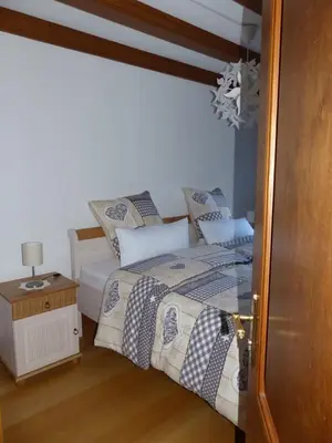 Ein Bett oder Betten in einem Zimmer der Unterkunft Ferienwohnung 