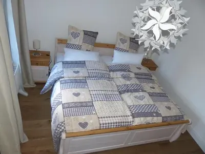 Ein Bett oder Betten in einem Zimmer der Unterkunft Ferienwohnung 