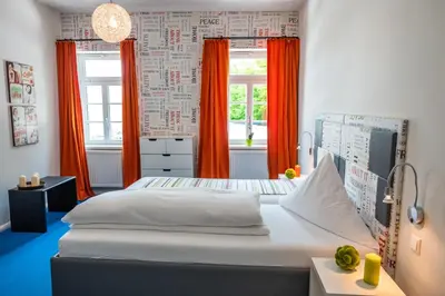 Ein Bett oder Betten in einem Zimmer der Unterkunft Domäne am See