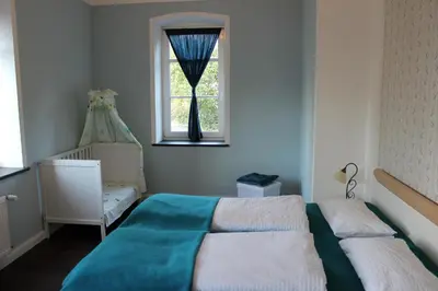 Ein Bett oder Betten in einem Zimmer der Unterkunft Ferienwohnung Ostwind