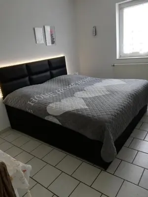 Ein Bett oder Betten in einem Zimmer der Unterkunft Holzfeld