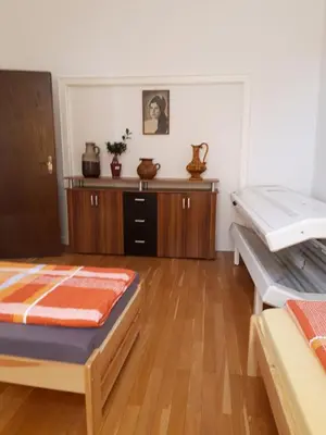 Ein Bett oder Betten in einem Zimmer der Unterkunft St Maximin City Ferienwohnungen