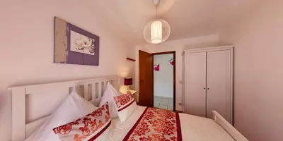Ein Bett oder Betten in einem Zimmer der Unterkunft Ferienwohnung Seeblick