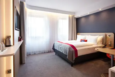 Ein Bett oder Betten in einem Zimmer der Unterkunft Holiday Inn Express - Trier by IHG