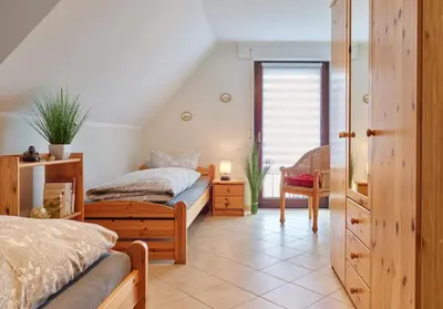 Ein Bett oder Betten in einem Zimmer der Unterkunft Ferienhaus Götten