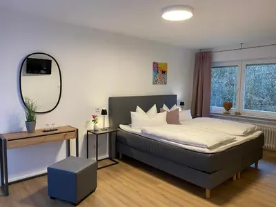 Ein Bett oder Betten in einem Zimmer der Unterkunft Hotel Ostermann