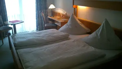 Ein Bett oder Betten in einem Zimmer der Unterkunft Winzerhof Brachtendorf
