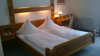 Ein Bett oder Betten in einem Zimmer der Unterkunft Winzerhof Brachtendorf