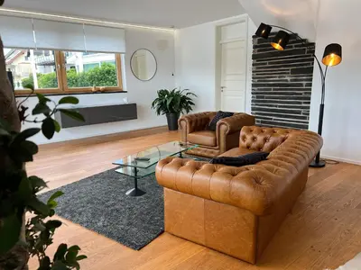 Ein Sitzbereich in der Unterkunft Weingut-Aparthotel Olinger