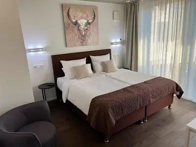 Ein Bett oder Betten in einem Zimmer der Unterkunft Weingut-Aparthotel Olinger