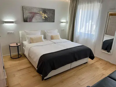 Ein Bett oder Betten in einem Zimmer der Unterkunft Weingut-Aparthotel Olinger