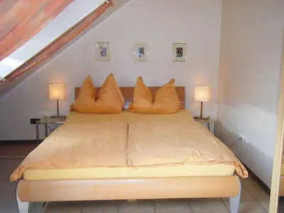 Ein Bett oder Betten in einem Zimmer der Unterkunft Ferienwohnung M. Lemmermeyer