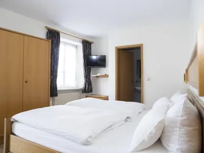 Ein Bett oder Betten in einem Zimmer der Unterkunft Hotel Café Alt-Piesport