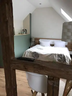 Ein Bett oder Betten in einem Zimmer der Unterkunft Historische Mühle Vogelsang