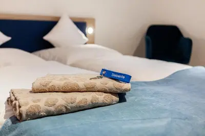 Ein Bett oder Betten in einem Zimmer der Unterkunft Siebente - Gästezimmer Gans im Grünen