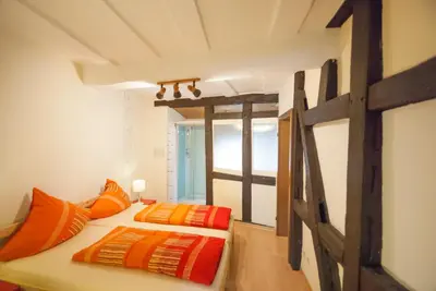 Ein Bett oder Betten in einem Zimmer der Unterkunft Alte Weinstube Burg Eltz