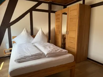 Ein Bett oder Betten in einem Zimmer der Unterkunft Ferienweingut Niessner