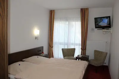 Ein Bett oder Betten in einem Zimmer der Unterkunft Hotel Pohl