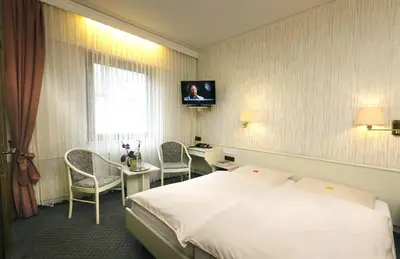Ein Bett oder Betten in einem Zimmer der Unterkunft Hotel Pohl