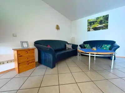 Ein Sitzbereich in der Unterkunft Ferienwohnung ehemaligen Schäferhof