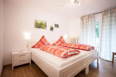Ein Bett oder Betten in einem Zimmer der Unterkunft Das Moseltor zu Koblenz