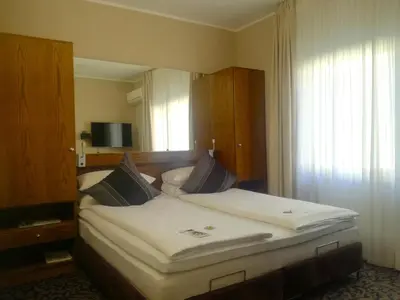 Ein Bett oder Betten in einem Zimmer der Unterkunft Top Hotel Krämer
