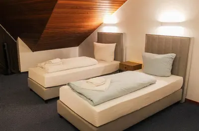 Ein Bett oder Betten in einem Zimmer der Unterkunft Hotel Simonis Koblenz