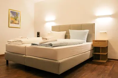Ein Bett oder Betten in einem Zimmer der Unterkunft Hotel Simonis Koblenz