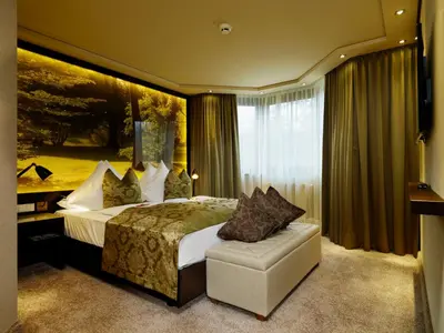 Ein Bett oder Betten in einem Zimmer der Unterkunft Land & Golf Hotel Stromberg