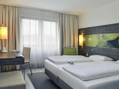 Ein Bett oder Betten in einem Zimmer der Unterkunft Mercure Hotel Koblenz