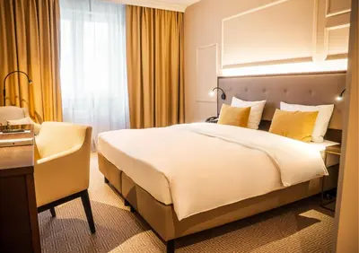 Ein Bett oder Betten in einem Zimmer der Unterkunft Parkhotel Kurhaus